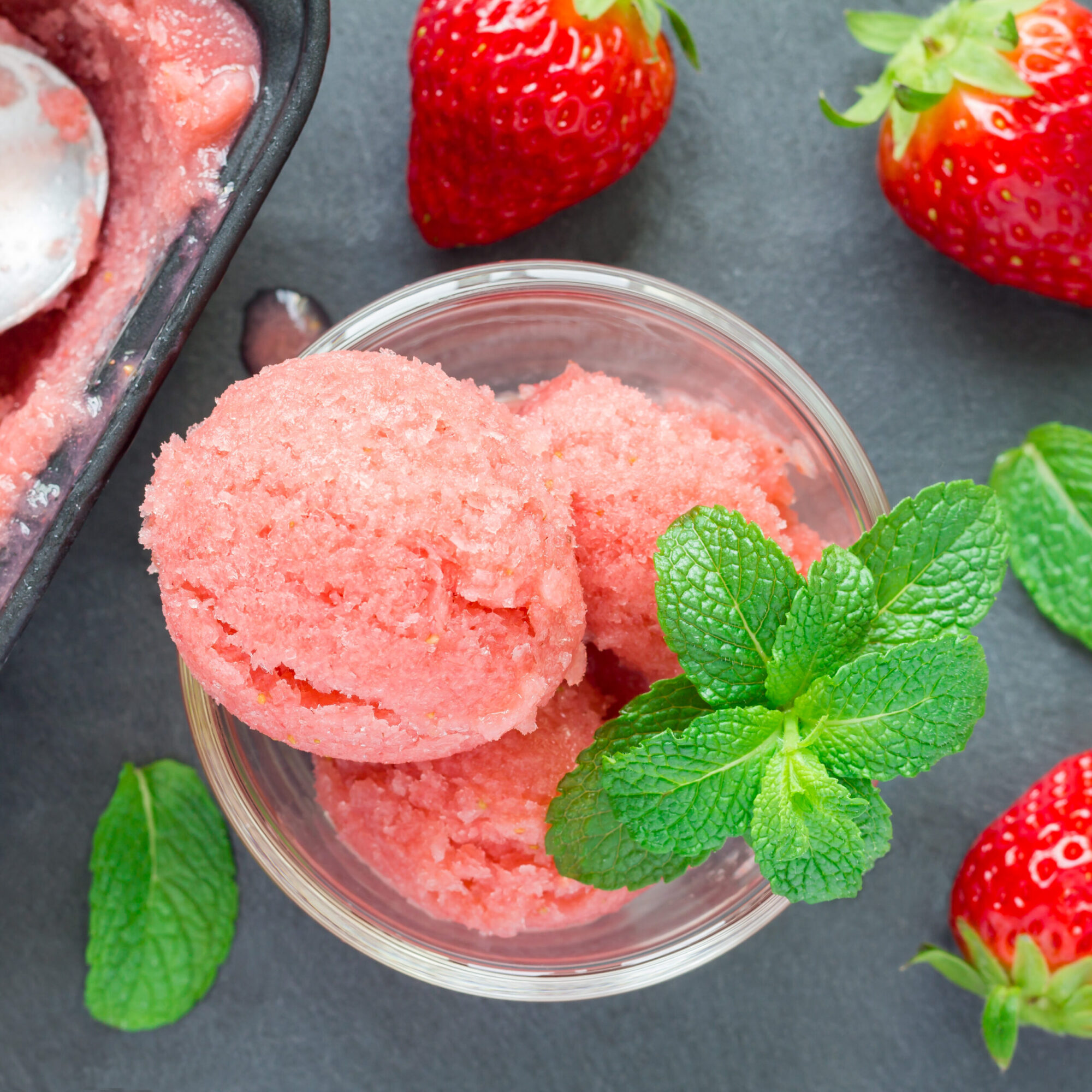 Homemade strawberry sorbet in glass, top view, square Homemade strawberry sorbet in glass, top view, square format